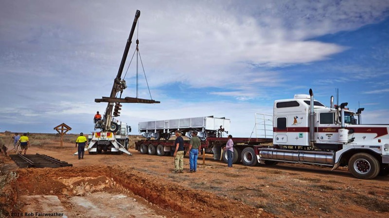 Unloading pre-fabricated rail sections