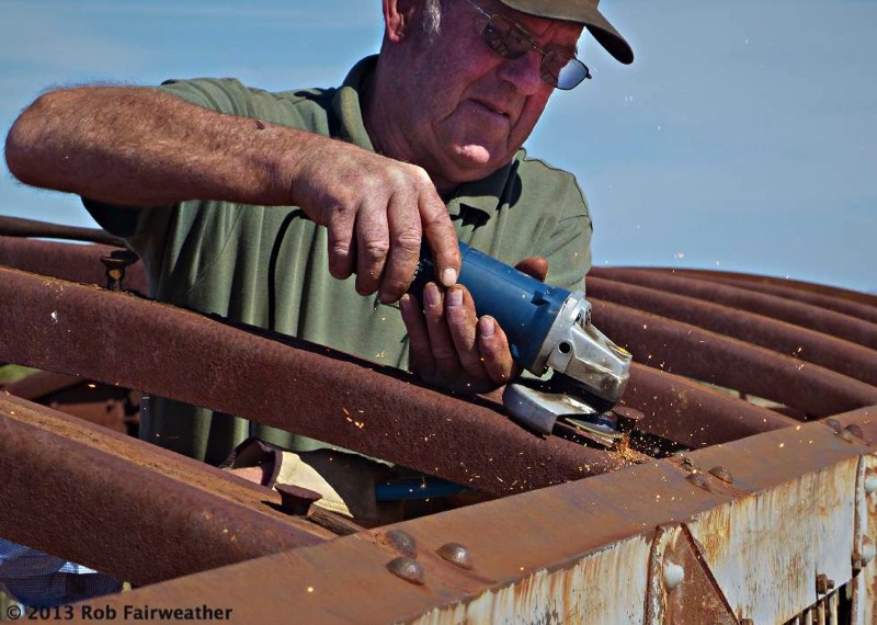 Cutting off old bolts after the rotten timber had been removed