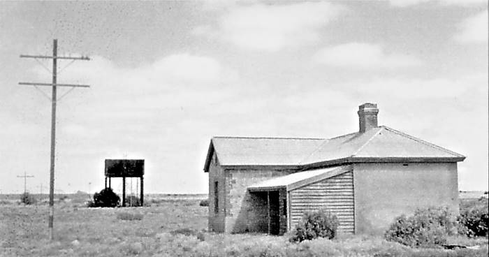 Fettlers cottage, water storage behind and in the far distance, the gangers house.